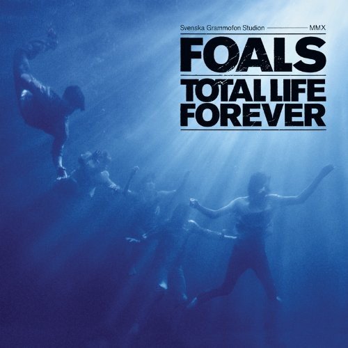 Foals album cover: underwater figures in blue, bold white text.