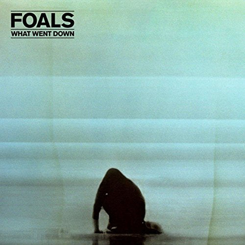 "Album cover with silhouette of a person crouching, 'Foals - What Went Down' text."