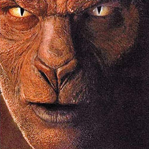 A close-up of a zombie's face with glowing yellow eyes.