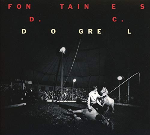 "Album cover with black and white image of man and horses under a circus tent."