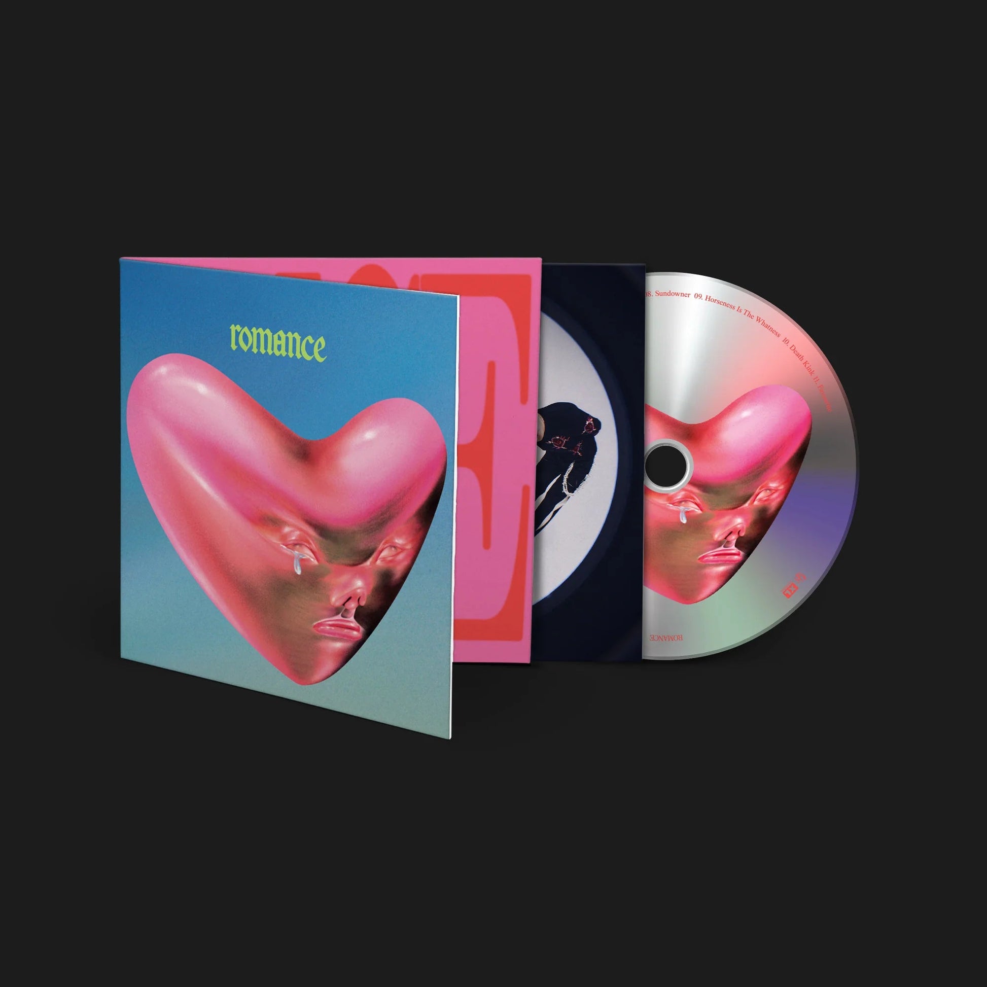 Fontaines D.C. "Romance" CD case with abstract pink heart and face image.