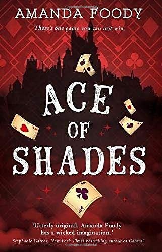 Book cover: dark city silhouette with playing cards and bold title text.