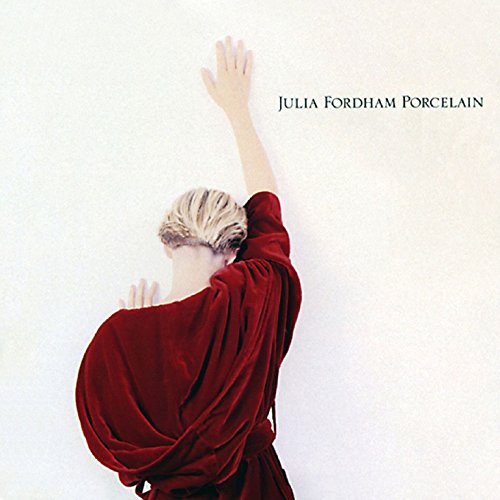 The image depicts a woman in a red dress on a music album cover.