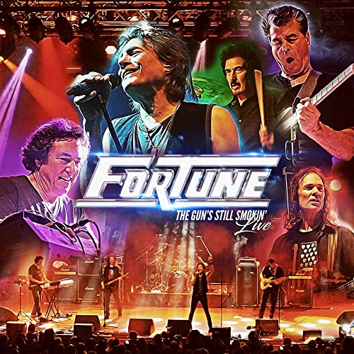 Fortune band performing live on stage with concert lighting and audience.