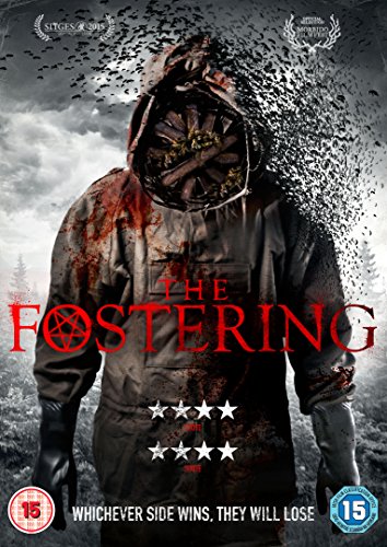 A person in a tattered hooded jacket with a wooden mask, surrounded by birds.