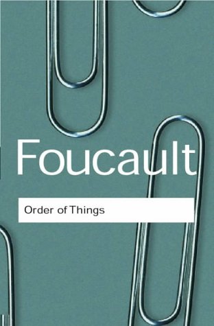 Green book cover with white text: “Foucault, Order of Things” and paperclips.
