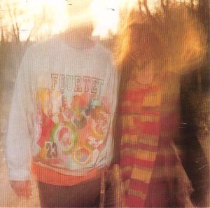 Blurred album cover for Fourtet’s “Pause” vinyl, featuring two figures.