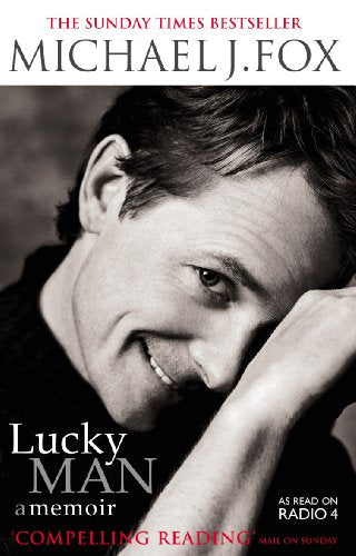 Close-up of Michael J. Fox on book cover, "Lucky Man: A Memoir".