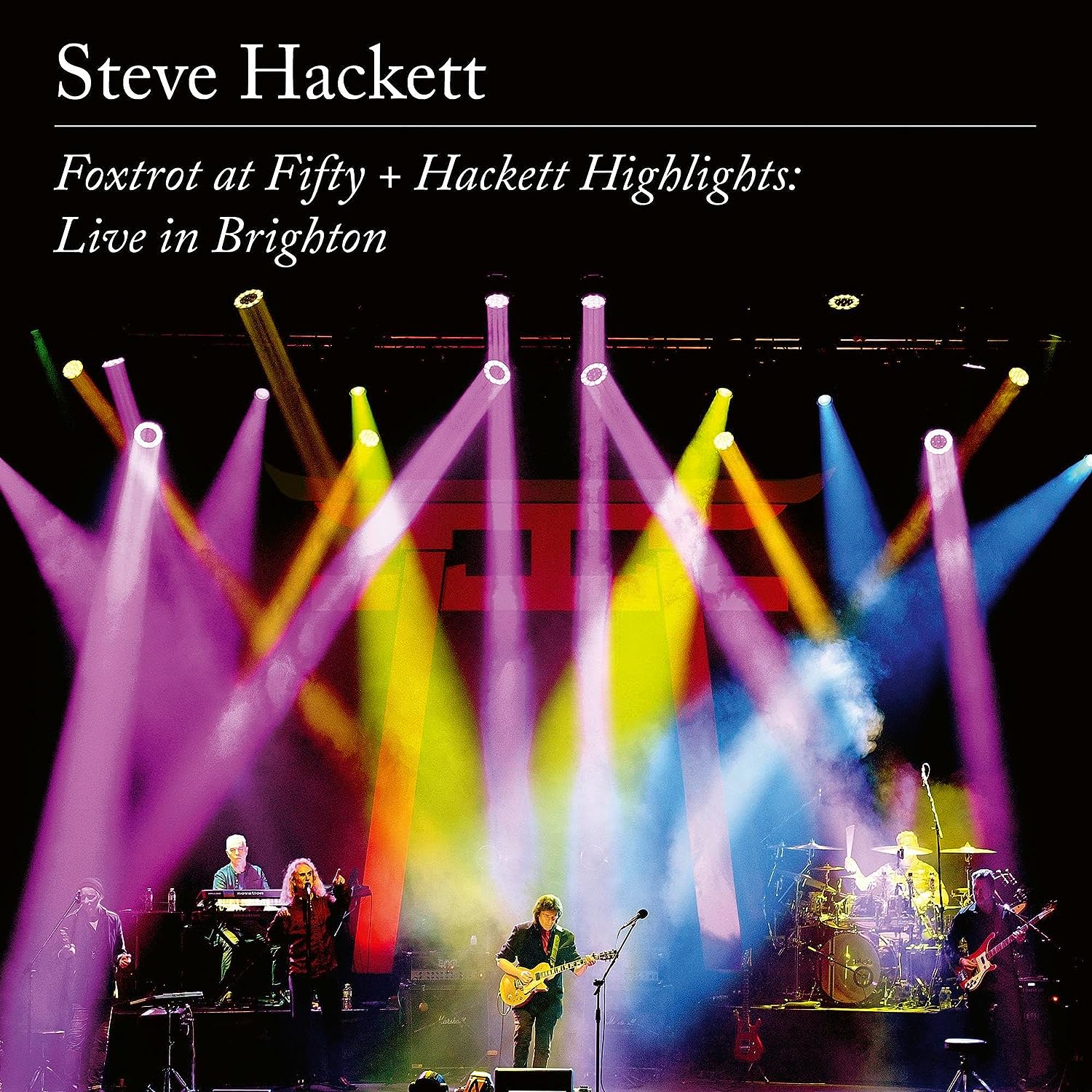 Steve Hackett concert album cover with stage lights and band performing.