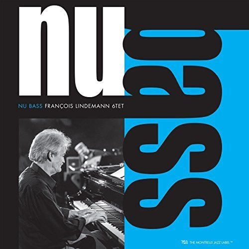 Vinyl album cover with a man playing piano, black, white, and blue design.
