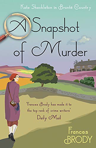 Book cover: woman in purple coat, landscape, magnifying glass, title “A Snapshot of Murder”.
