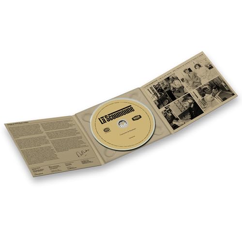 Open CD case with beige cover and central silver disc labeled “La Scoumoune”.