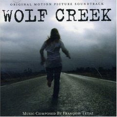 Vinyl record cover for "Wolf Creek" soundtrack, woman running on road.
