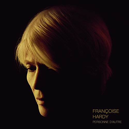 Album cover featuring a close-up of a woman's face with blonde hair, partially shadowed.