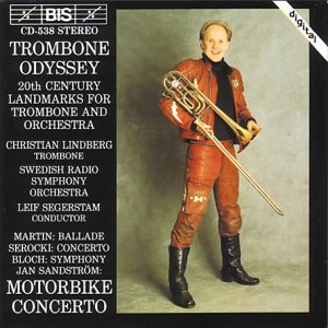 CD cover: Man in leather suit holding a trombone.