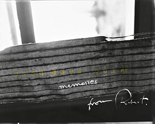 Black and white photo of wooden slats with handwritten text.