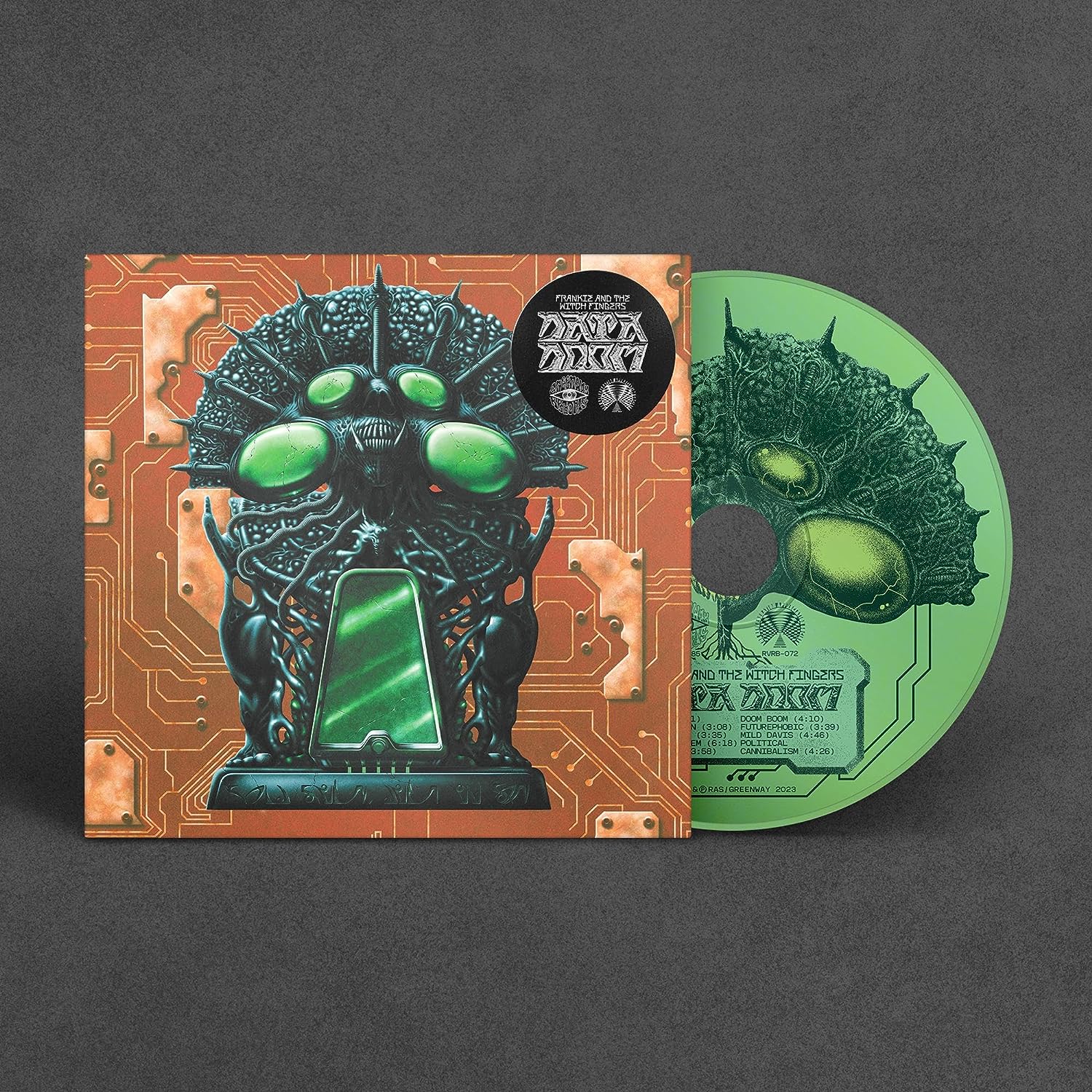"CD case and disc with futuristic, green, robotic creature artwork against a circuit board background."