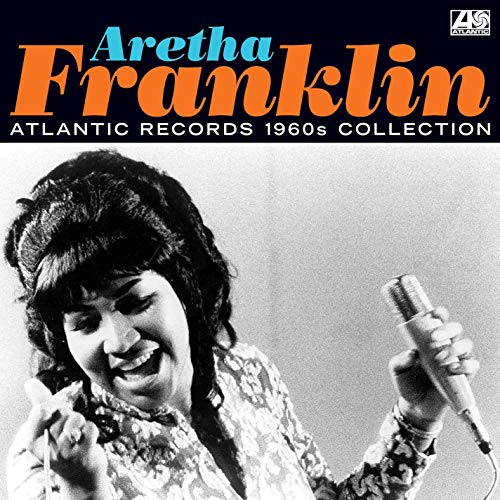 Aretha Franklin singing into a microphone on album cover.
