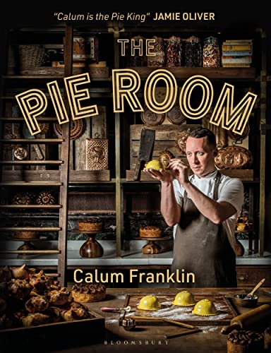 Cookbook cover featuring a chef with pies in a rustic kitchen setting.
