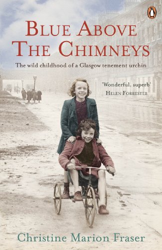 Vintage photo of a girl and boy on a tricycle in a city street.