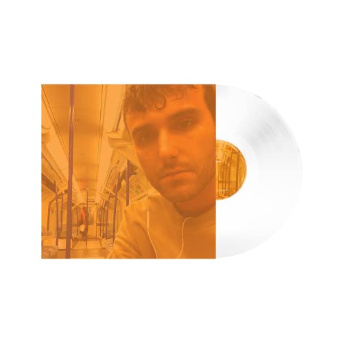 Fred again.. album cover featuring a man’s face and white vinyl record.