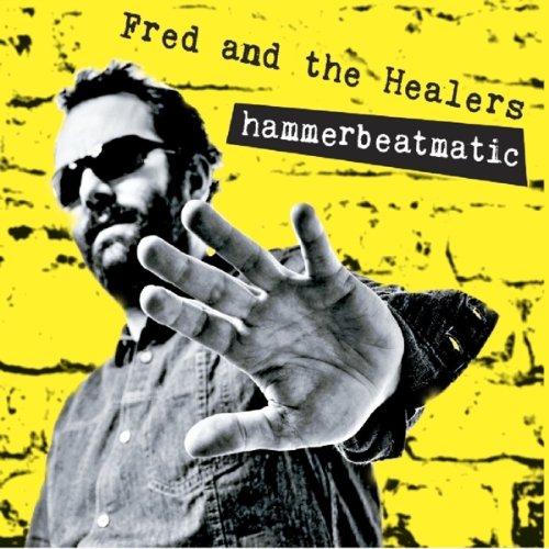 CD cover: man in sunglasses with outstretched hand on yellow brick.