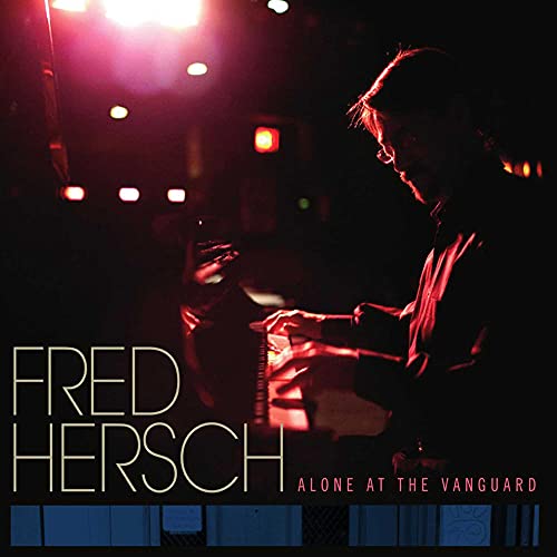 Fred Hersch at a piano, dimly lit stage, album cover art.