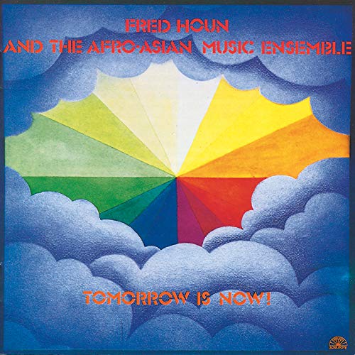 CD cover: colorful umbrella against blue clouds, text “Tomorrow Is Now!”.