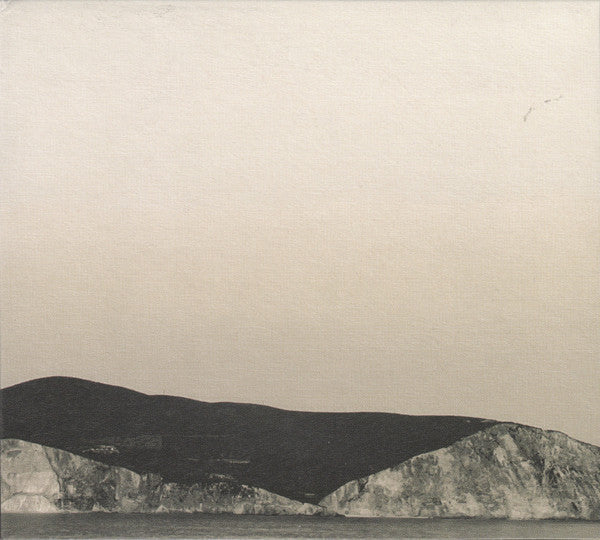 CD cover with a grayscale landscape of mountains and water.