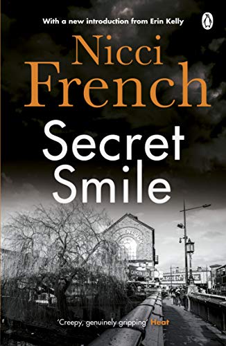 Book cover: "Secret Smile" by Nicci French, with a railway station scene.