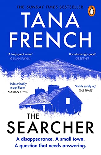 Book cover for The Searcher by Tana French featuring a house and distant mountain.
