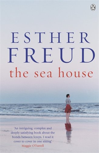 Book cover: "The Sea House" by Esther Freud, featuring a woman on a beach.