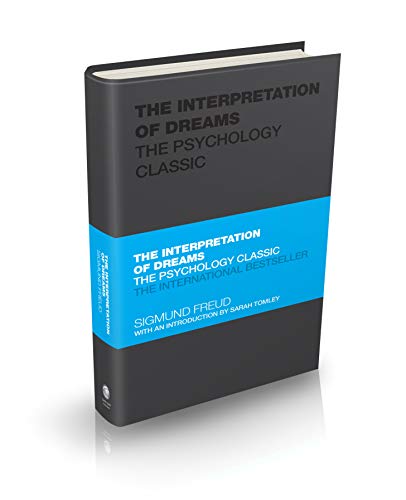 Black book titled The Interpretation of Dreams with a blue horizontal band across center.