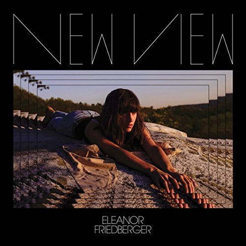 Album cover with a woman lying on a rocky surface, surrounded by a black border.