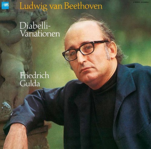Vinyl album cover featuring a man in dark clothing against a blurred green background.