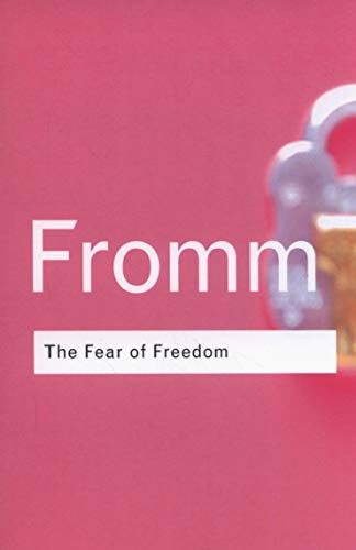 Book cover with a pink background, a padlock, and the text Fromm The Fear of Freedom.
