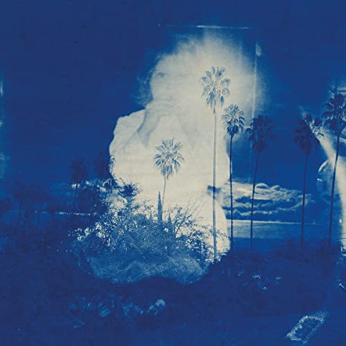 Blue-toned album cover with a ghostly figure and palm trees.