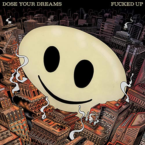 Album cover: Smiling face over a detailed, smoky cityscape.