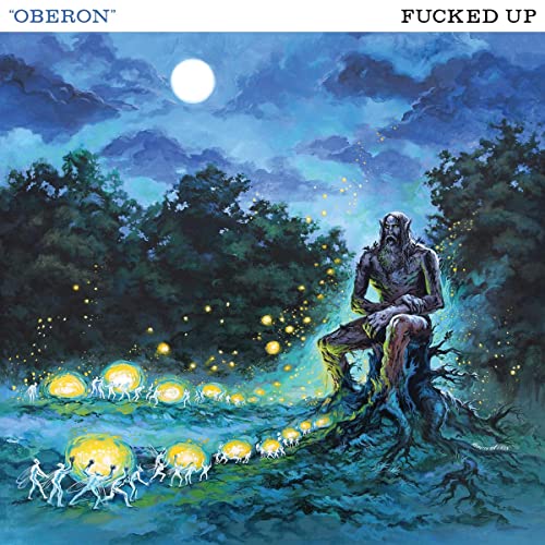 Fantasy album cover: a seated, stony figure amidst glowing, dancing figures.
