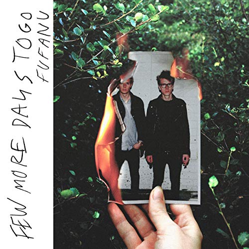 Album cover with two men in suits partially consumed by flames.