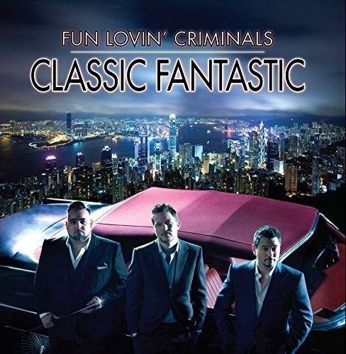 "Album cover featuring three suited men standing by a red car at night."
