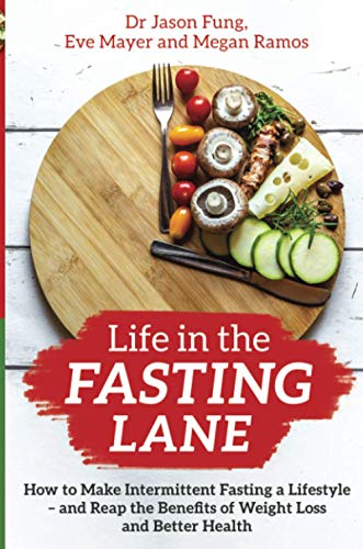Book cover: food on a wooden board with red “FASTING” text.