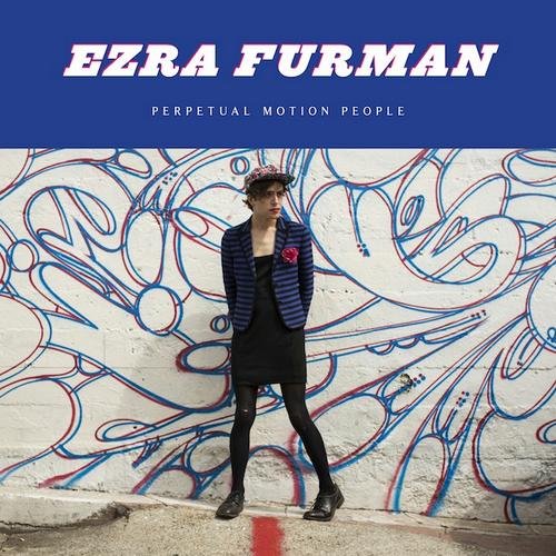 "Album cover featuring Ezra Furman standing against a graffiti wall, wearing black attire."