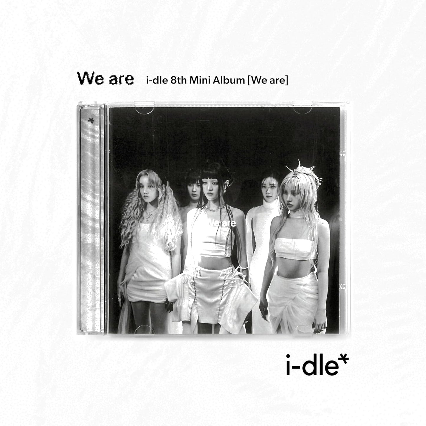 CD jewel case showing (G)I-DLE members in white outfits against a black background.