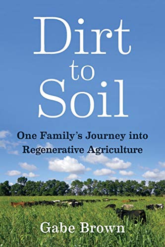 Book cover showing cattle grazing in a green field under a blue sky.