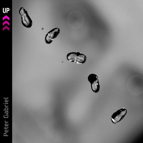 Peter Gabriel’s “Up” CD cover: grayscale face with floating water droplets.