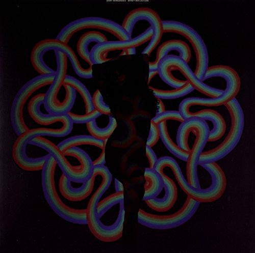Vinyl record cover with a silhouette and colorful, swirling pattern on a black background.