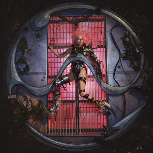 "Album cover featuring a woman with pink hair in a metal cage."