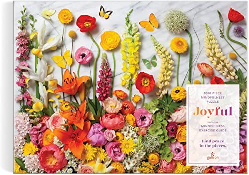Colorful arrangement of flowers and butterflies on a marble background.