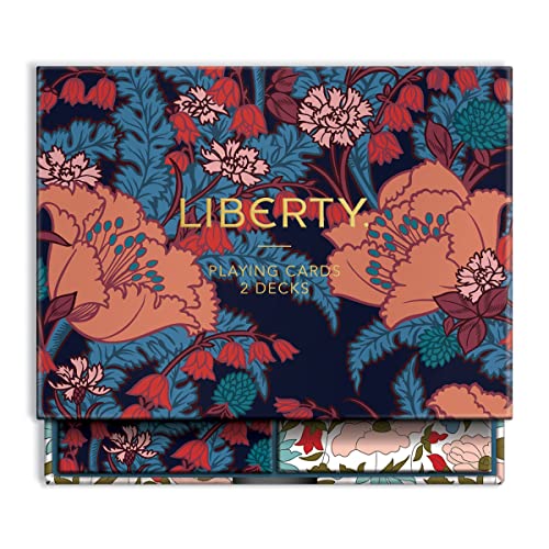 A box set of two playing card decks featuring a dark blue floral pattern.